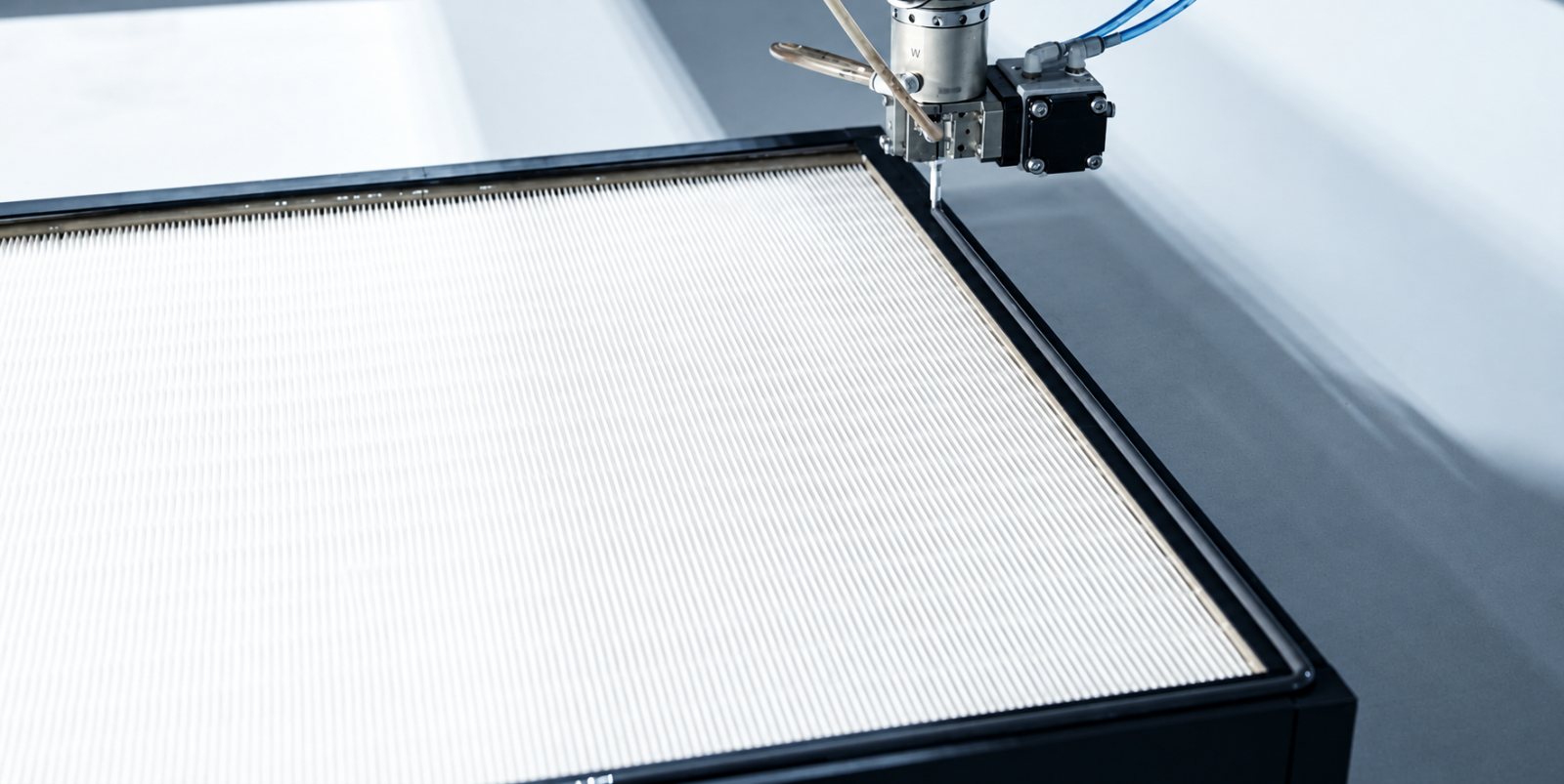 Sealant application during HEPA filter production